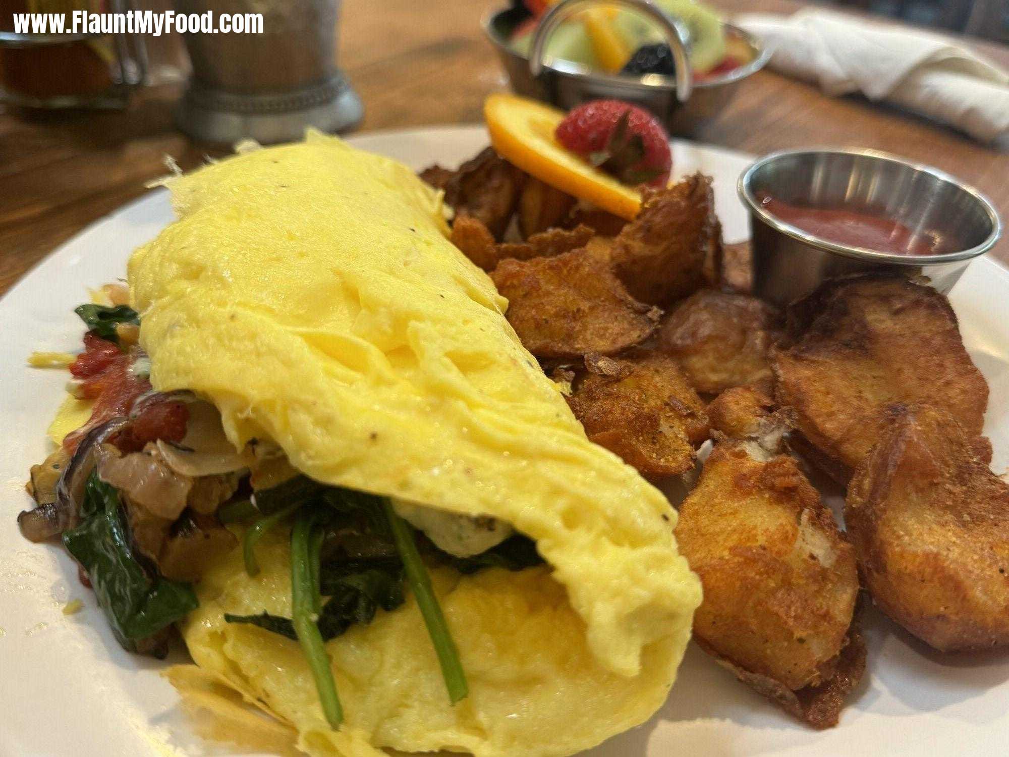 Local foods kitchen off Hulen in Fort Worth, Texas omelette, fruit and potatoes